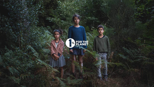 Three young people are standing in a jungle-like forest. In the foreground is the logo of One Percent for the Plane