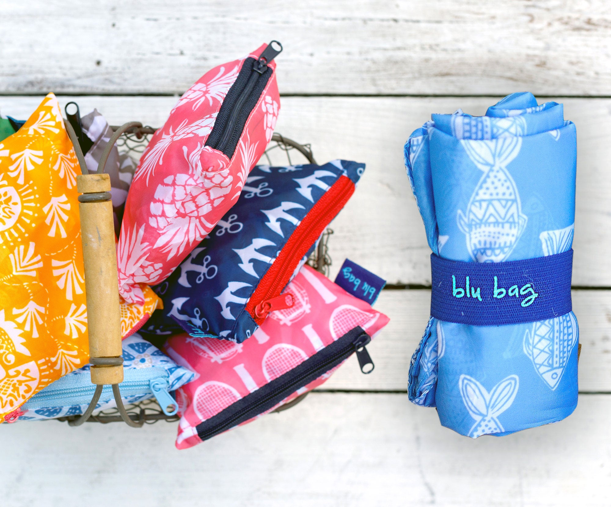 reusable blu bags in zipper pouches and rolled up with an elastic band
