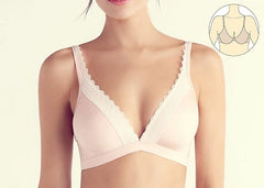 model is wearing a bra with a close set centre gore