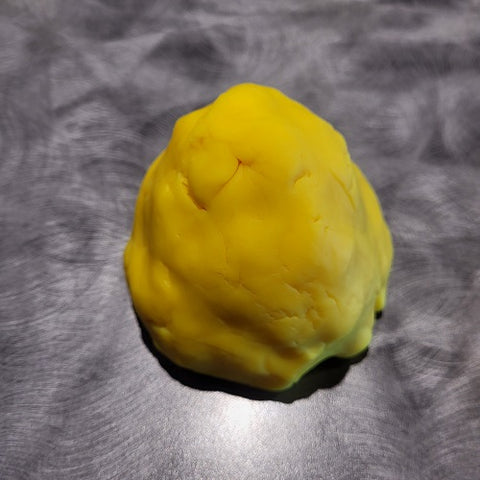 Image of playdoh that indicates a different shape than the previous image.