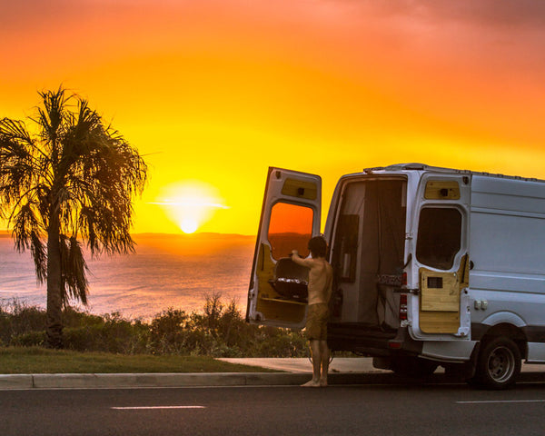 A travelling van at sunset