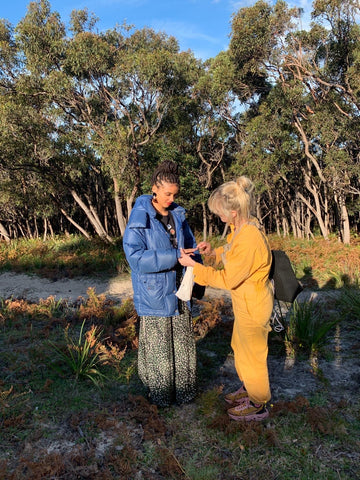 A behind the scenes shot from the Sans Beast Series 6 campaign, showing two women talking and planning. 