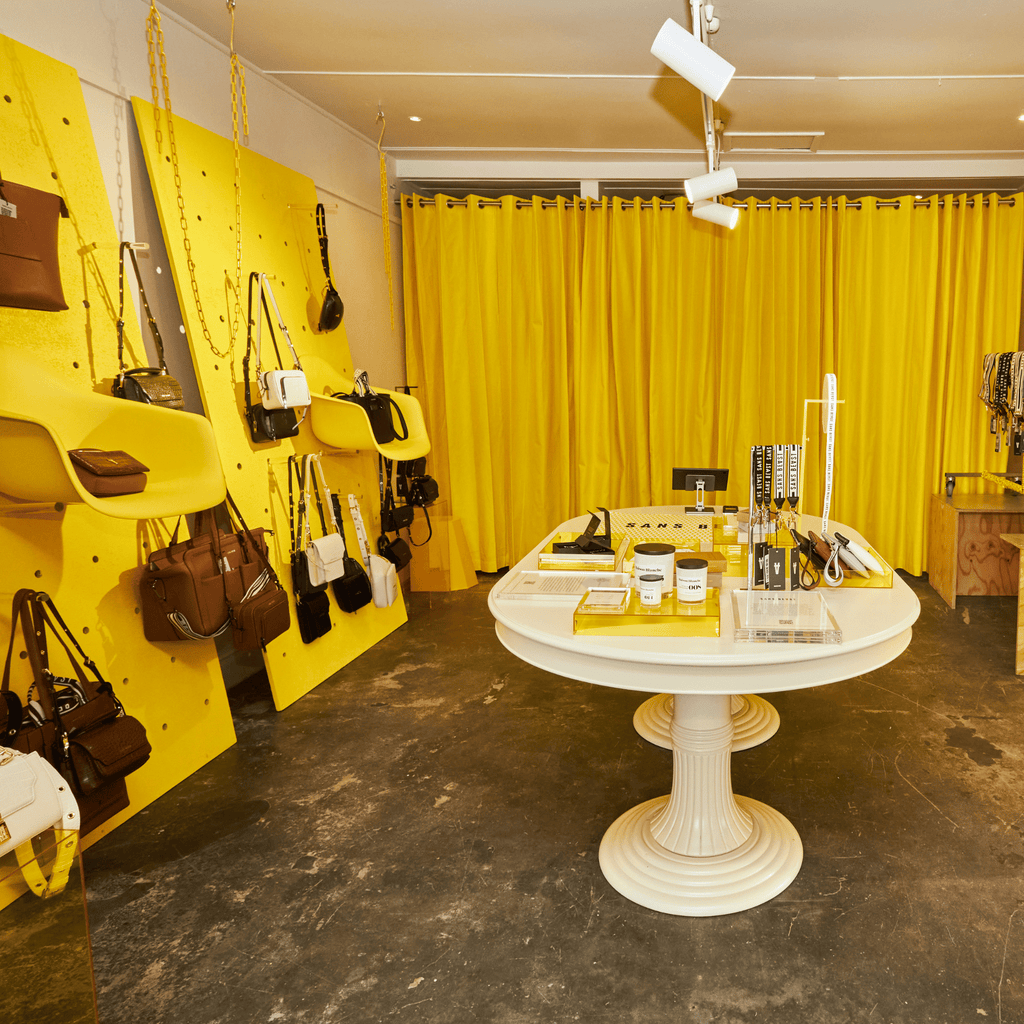 Image of the yellow-infused interior of the Sans Beast Summer Pop Up in Fitzroy, Victoria