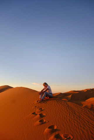 Karissa sitting in the Moroccan desert