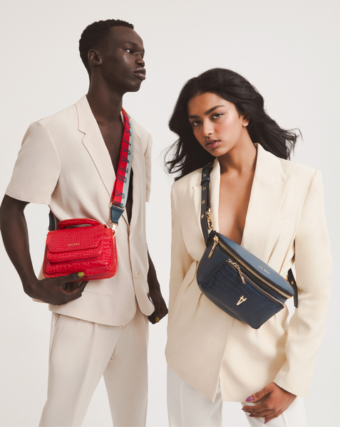 Magbul wears the Reader Satchel + Highway Strap in Chilli; Nethmi wears the Bright Spark crossbody in Denim