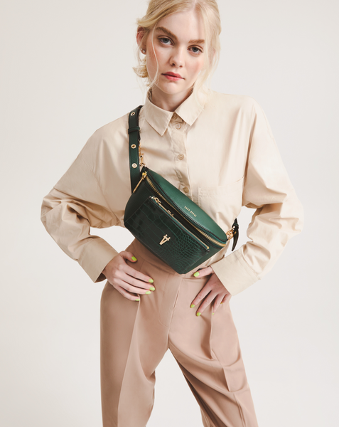 Penny wears the Bright Spark crossbody in Forest green