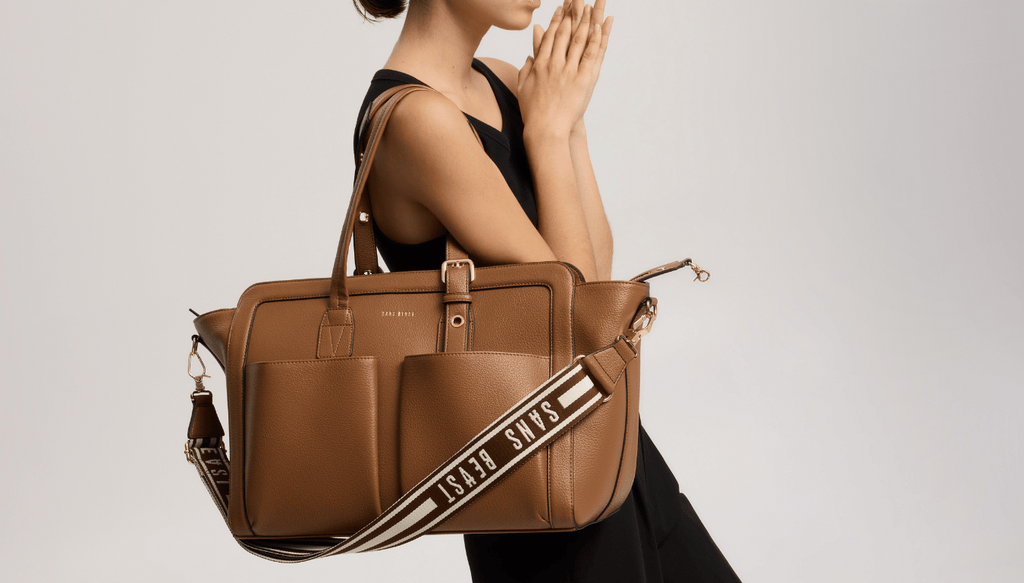 Eugenia carries the Daytripper Tote in Cinnamon + Gold