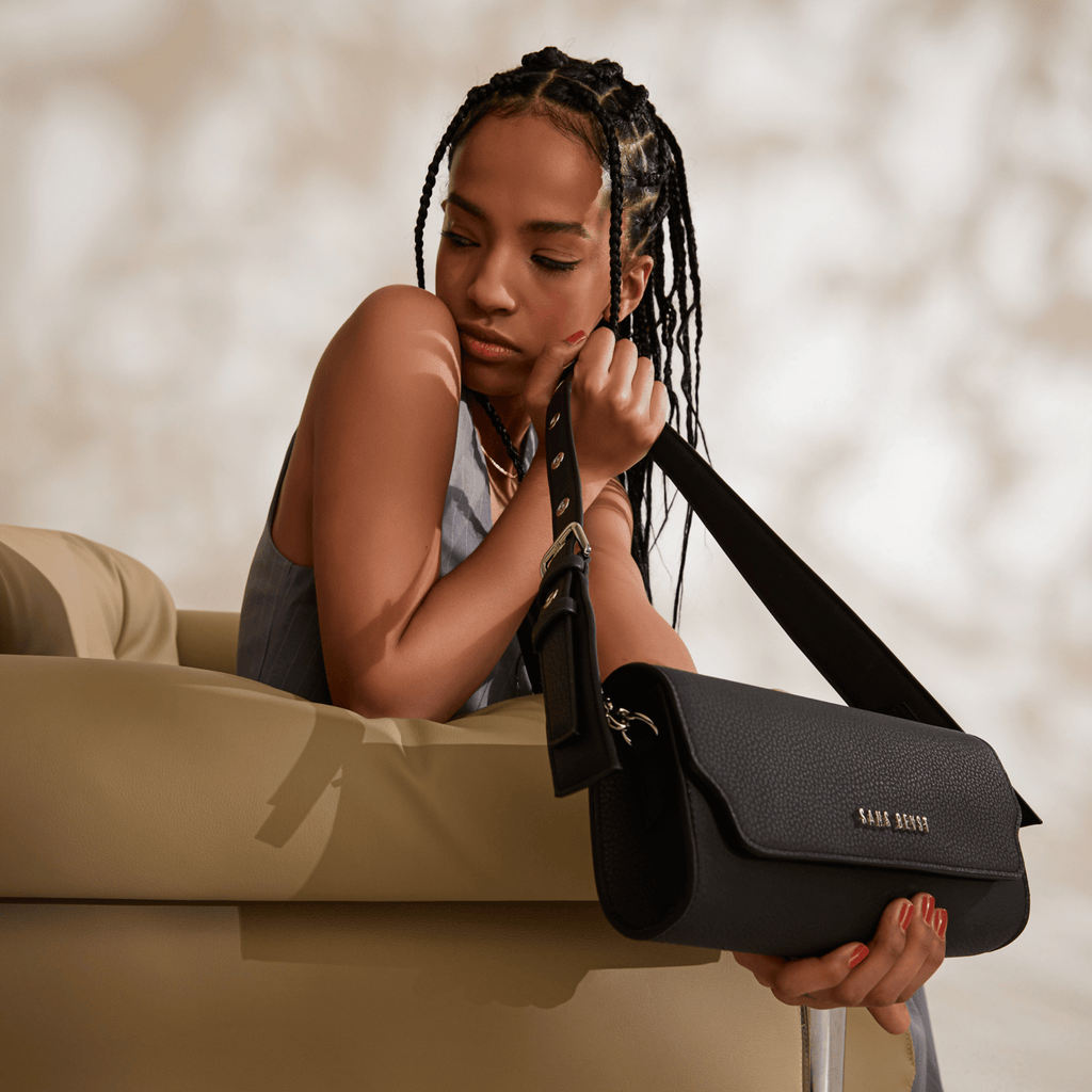 April holds the Illuminate Mirum® handbag