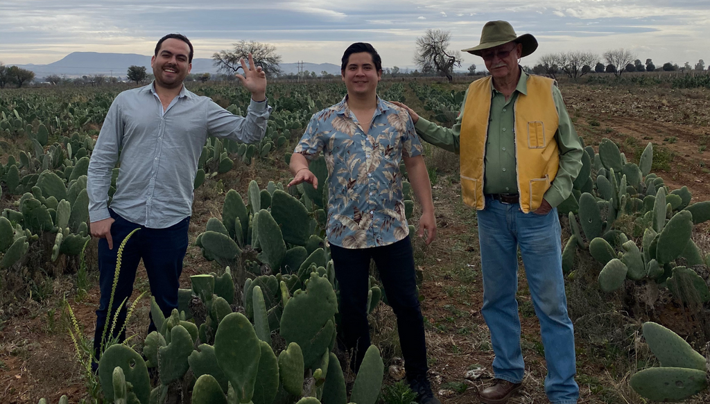 Desserto Pelle cactus leather plantation with founders Adrian Lopez Velarde and Marte Cazarez with ranch owner Francisco with nopal plants surrounding them in Zacatecas, Mexico