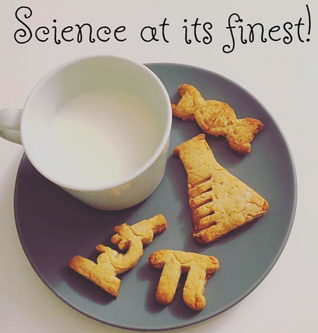 Brown cookies made from scientific cookie cutters with milk