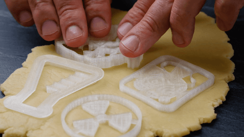 Cut cookies out of dough with cookie cutter