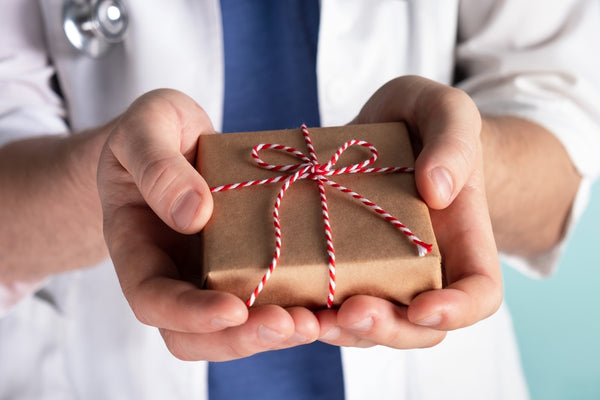 Gift in doctor's hands