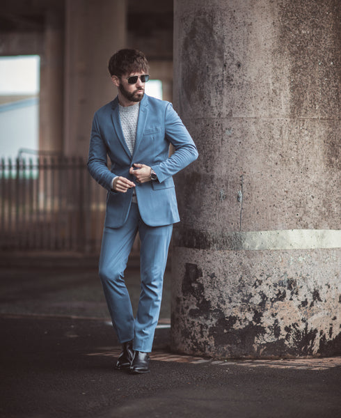 Buttoning Blue Suit