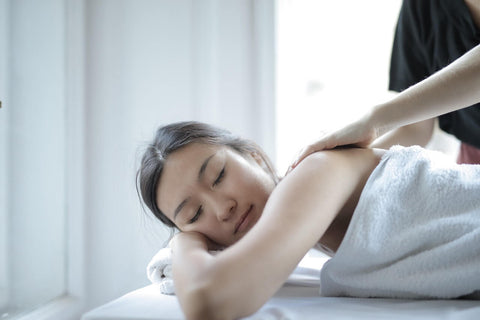 Asian woman relaxing during a massage