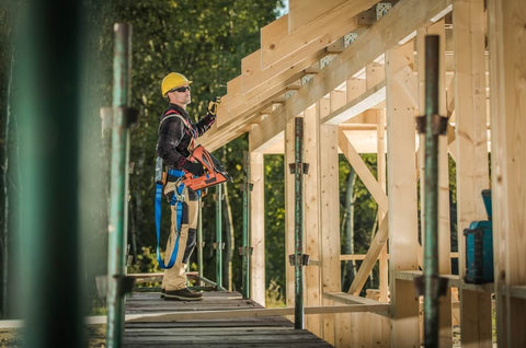 Construction guy building backyard sauna