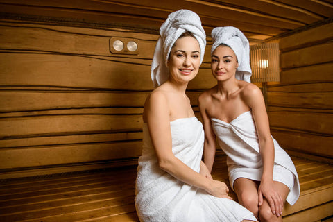 two women sitting in the sauna