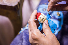 Sewing a handmade puppet