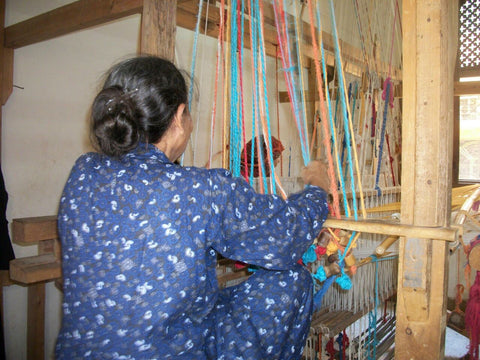 Akhmim - Woman weaving on horizontal loom