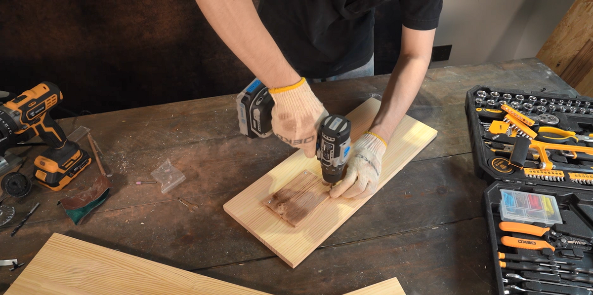 Cut another wood panel and cover it on the holder hole, use a screwdriver, and nail them together.