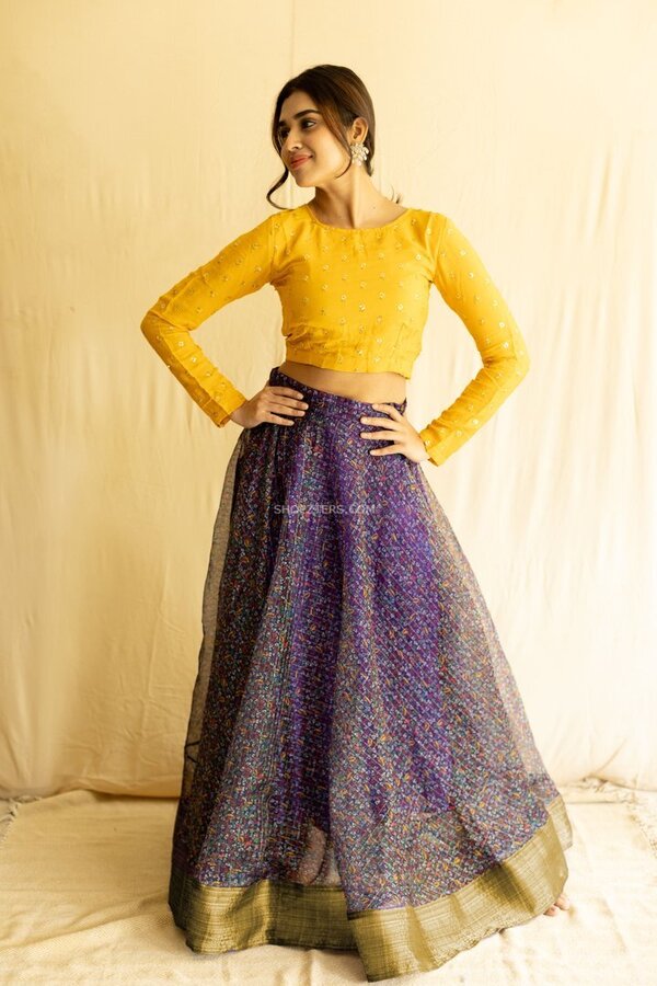 purple top yellow skirt
