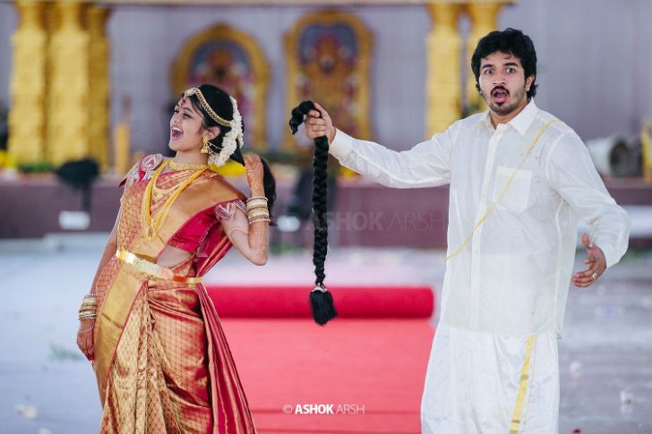 Photo of cute south indian couple shot with bride in red saree