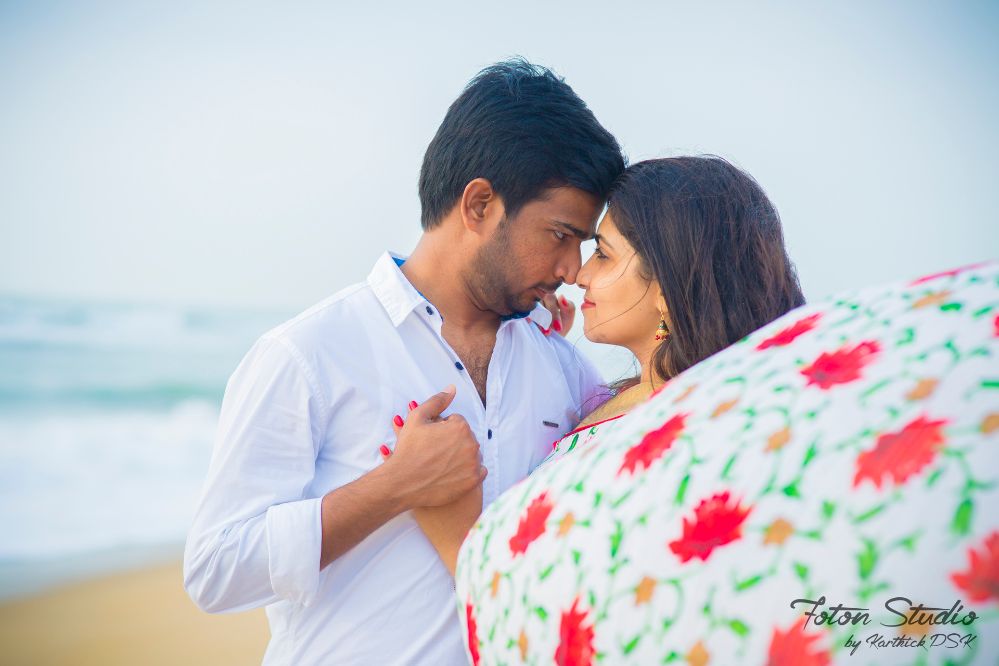 Photo of cute south indian couple shot with bride in red saree