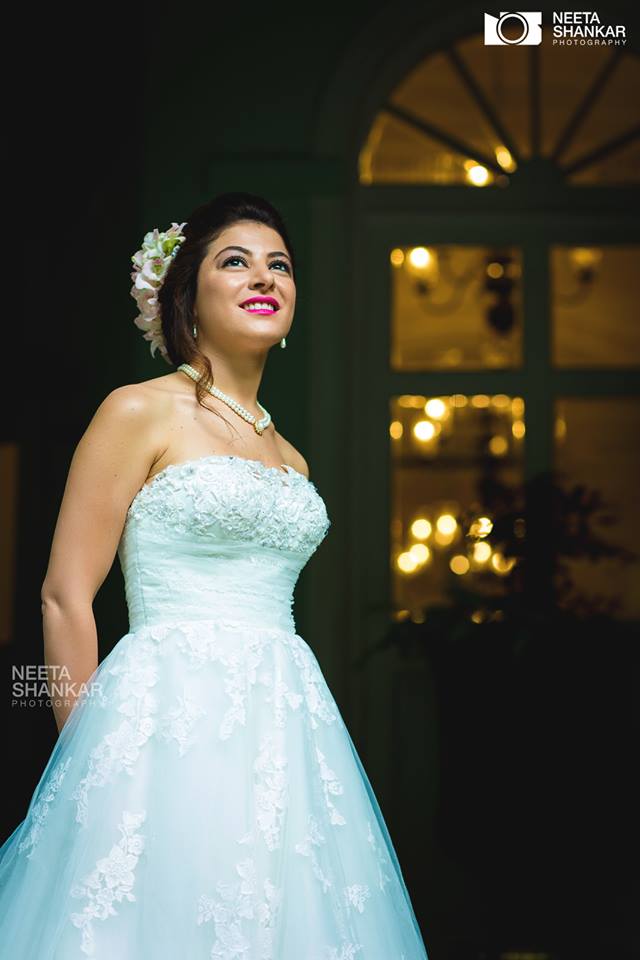 Elegant srunning woman sitting in armchair and looking at you. Pretty lady  with hairstyle wearing pink ball gown or evening dress. Stock Photo | Adobe  Stock