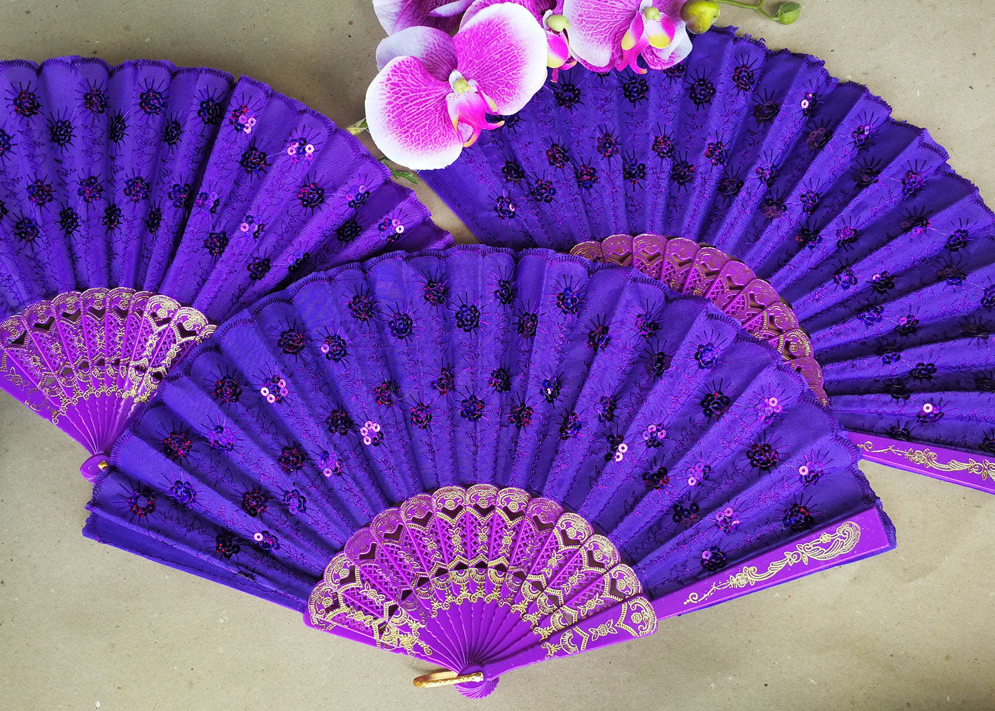 purple hand fan