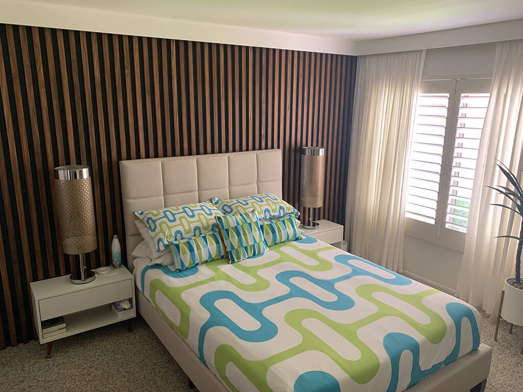 Mid-century modern bedroom makeover wood slat wall final result with furniture