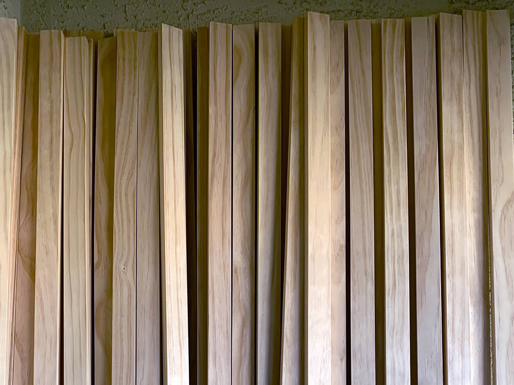 Mid-century modern bedroom makeover wood slat wall after conditioner