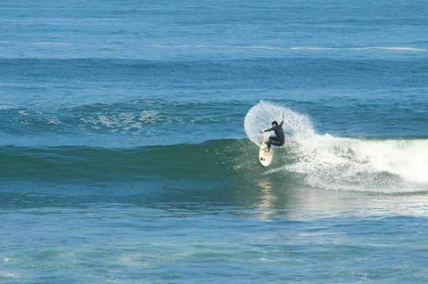 Jules Coignard surfing