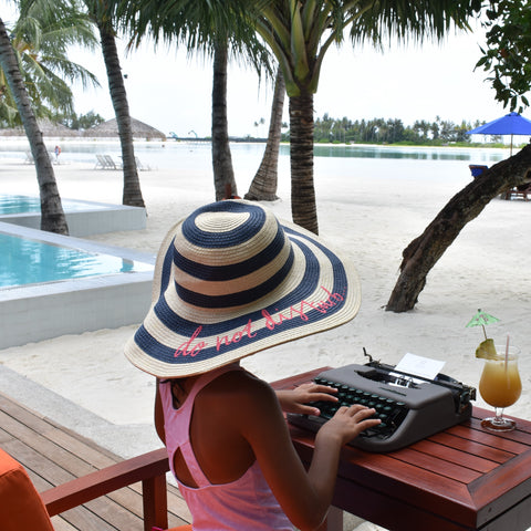 Kid typing on a typewriter