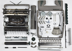 smith corona typewriter fully dismantled with keys and parts out. 