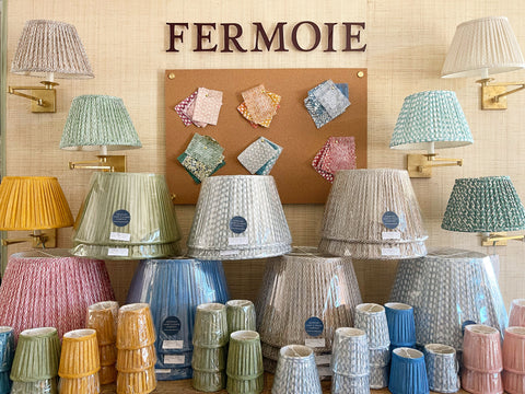 A display of colorful Fermoie fabric lampsahdes