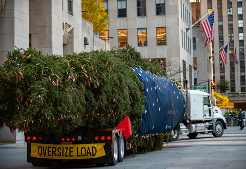 Photograph of the Rockefeller Center Christmas Tree on a flat bed truck 