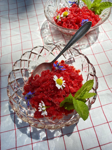 Elderberry syrup granita in crystal bowls on a checkered tablecloth