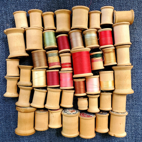 spools of thread, a row of spools of thread and a spool of thread