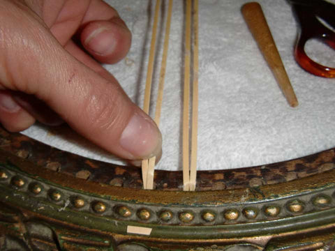 (Individual strand of cane glued into framework)