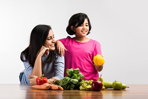 Mom and Daughter with healthy vegetables