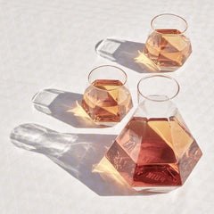 geometric drinking glasses and decanter sparking in light