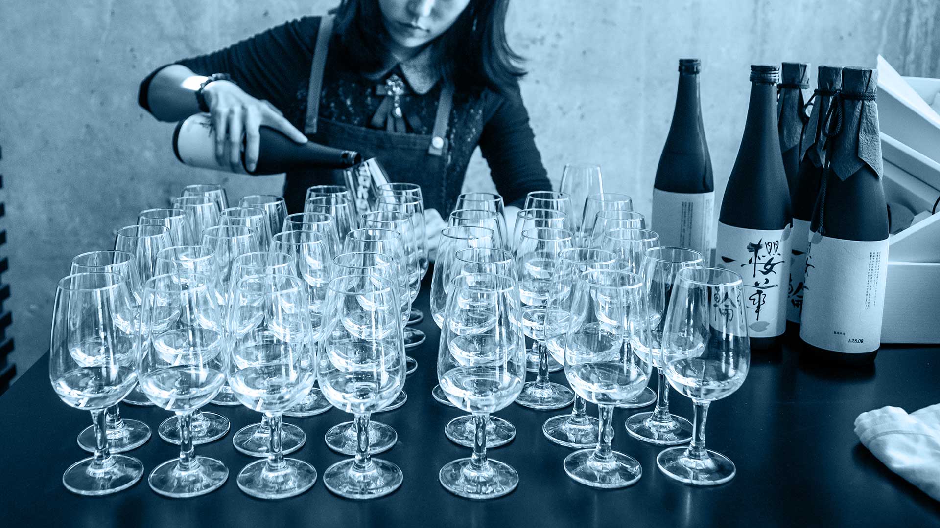 Bartender/Waitress pouring Japanese saké