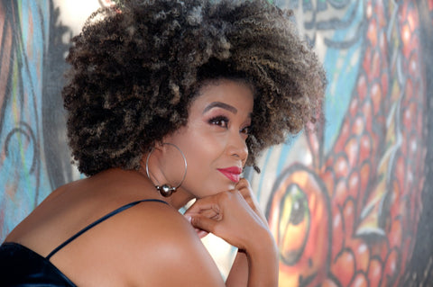 african american woman with curly natural hair and red lipstick