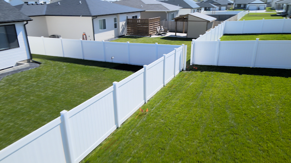 Vinyl fence materials assembled into high-quality residential fencing.