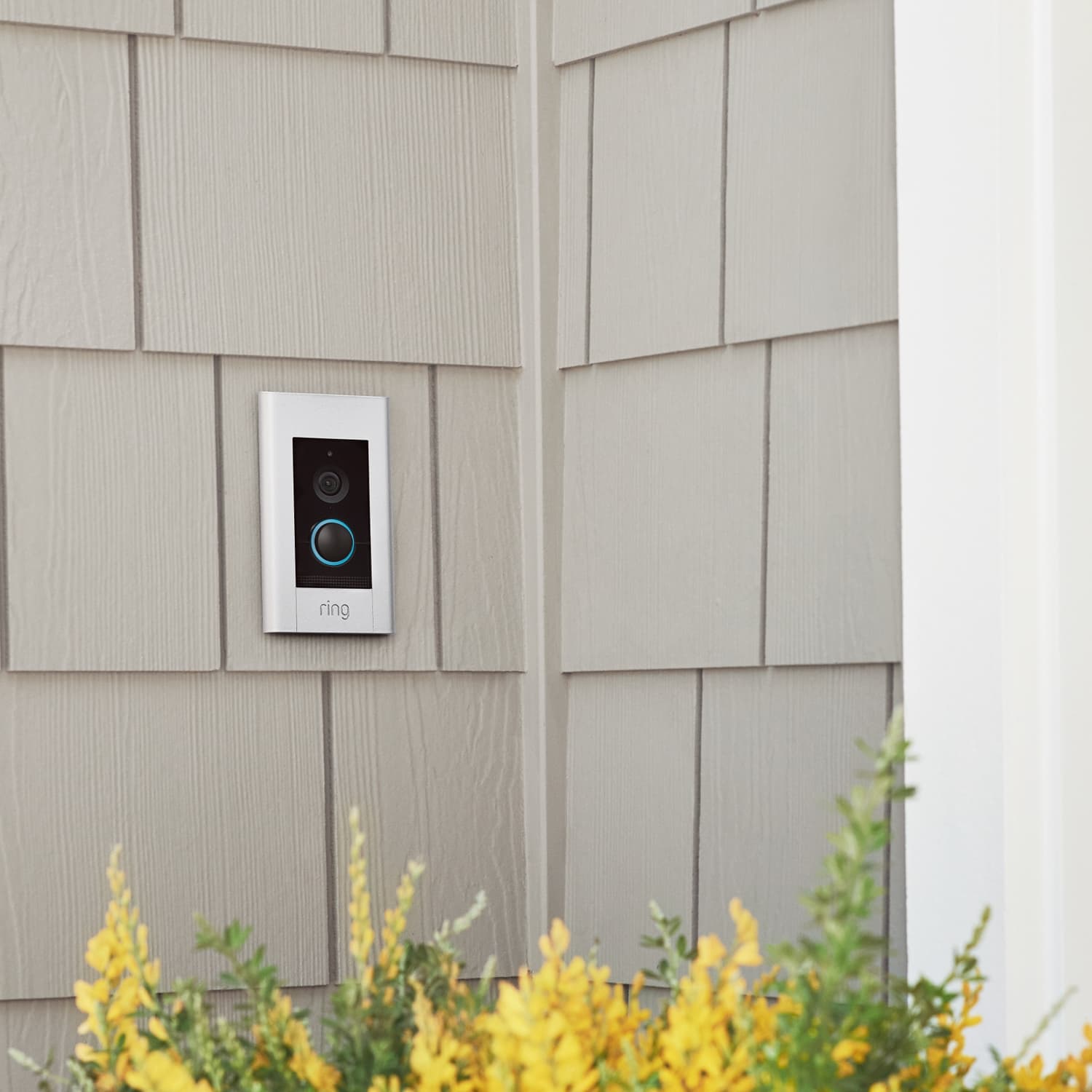 Video Doorbell Elite (Power over Ethernet) - Video Doorbell Elite with pearl white finish mounted on shingle siding of a home near a corner.