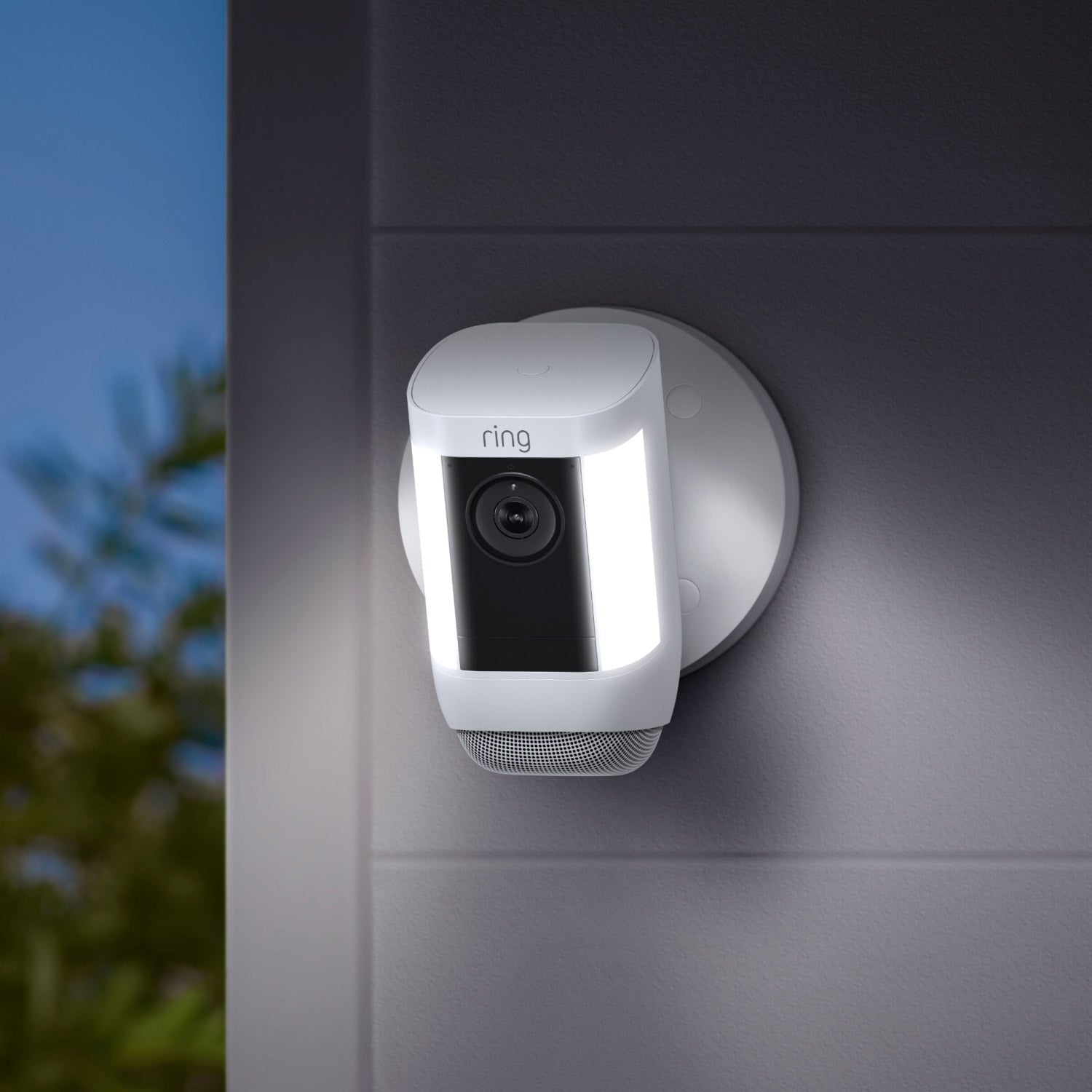 Spotlight Cam Pro (Wired) - Spotlight Cam Pro, Wired model in white, mounted on exterior wall with lights illuminated.