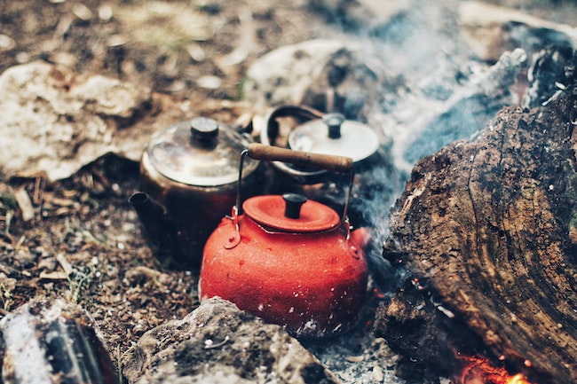 A coffee pot in a campfire