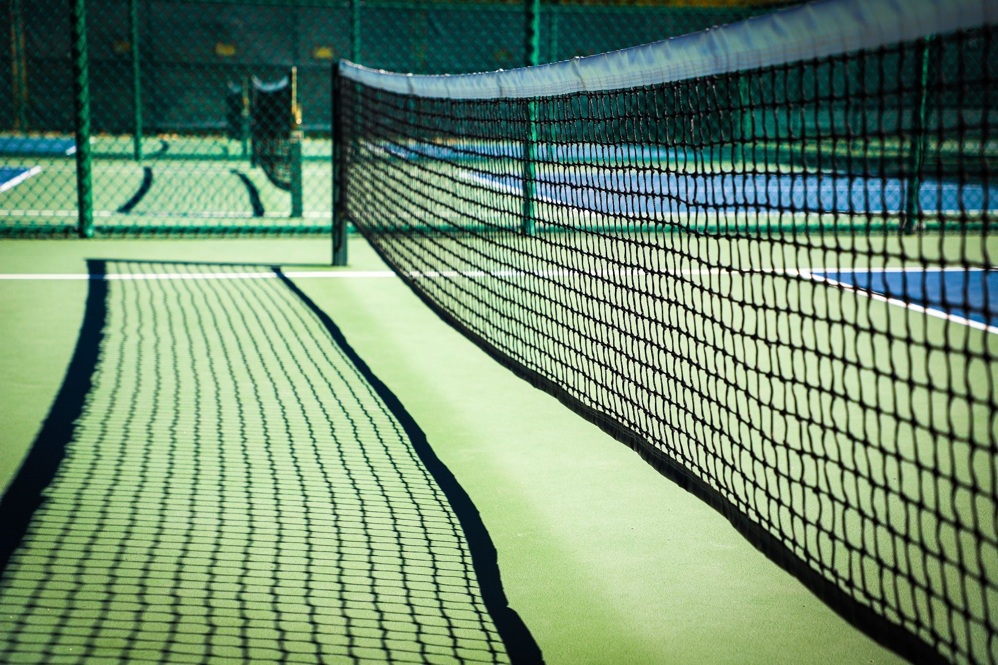 A pickleball net on a court