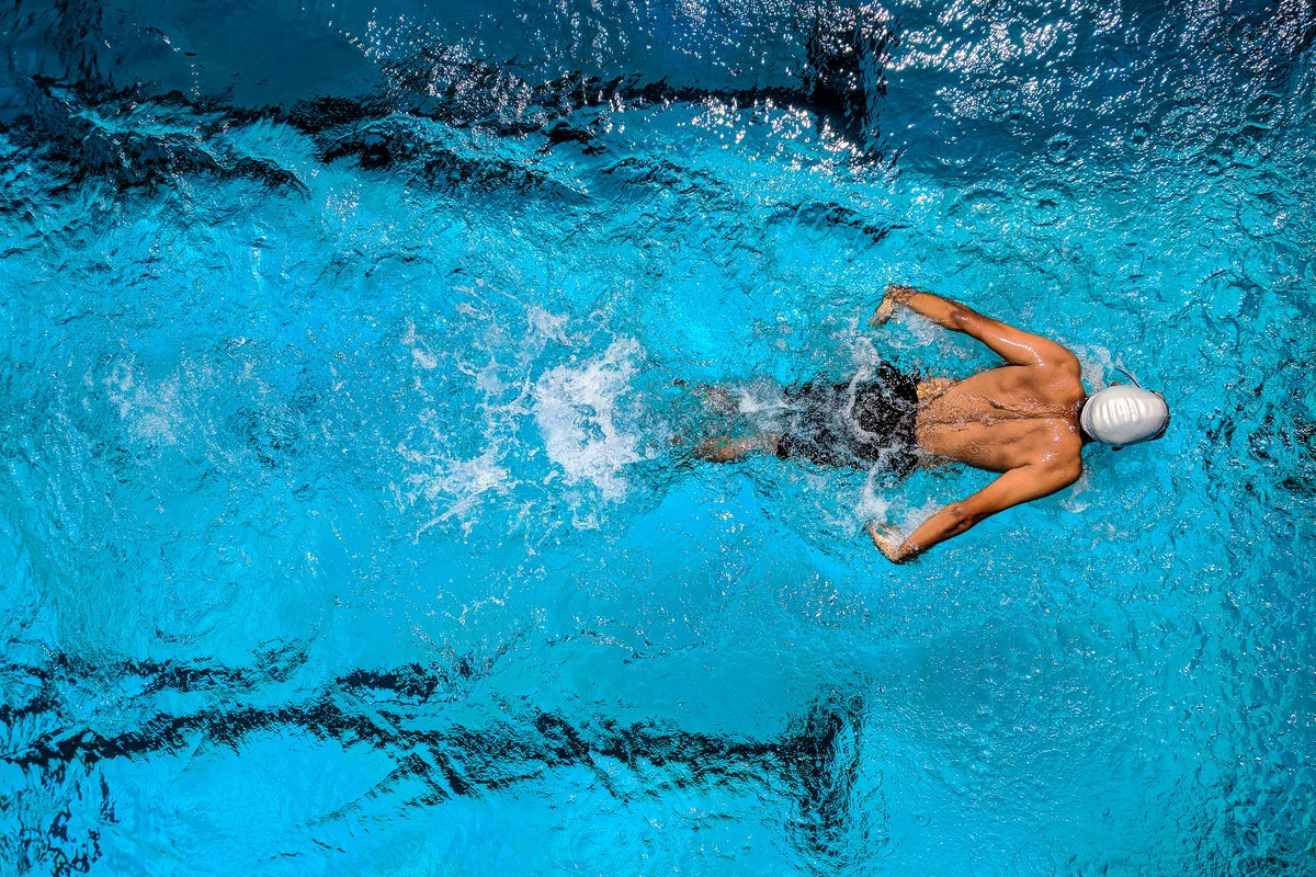 Person swimming in a pool