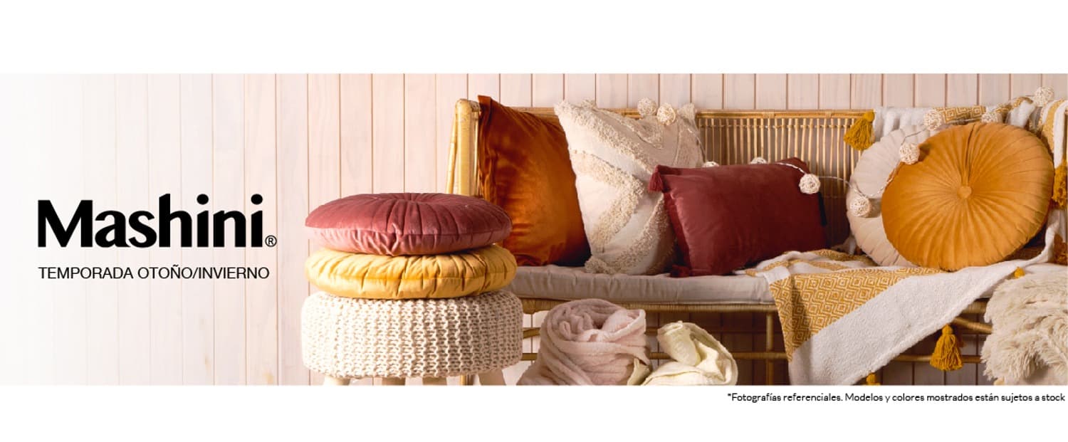 cojines marca mashini de distinos colores y diseños ensima de un sofa