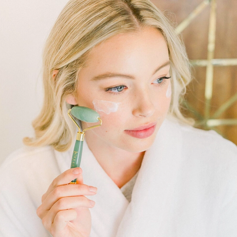 woman using face roller